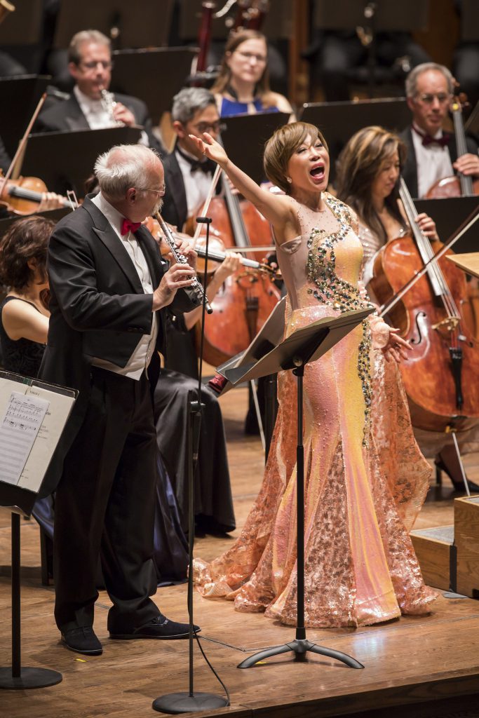 Soprano Sumi Jo with principal flute Philip Langevin at the New York Philharmonic concert Tuesday night at David Geffen Hall. Photo: Chris Lee